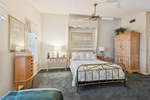 a bedroom with a bed and a couch