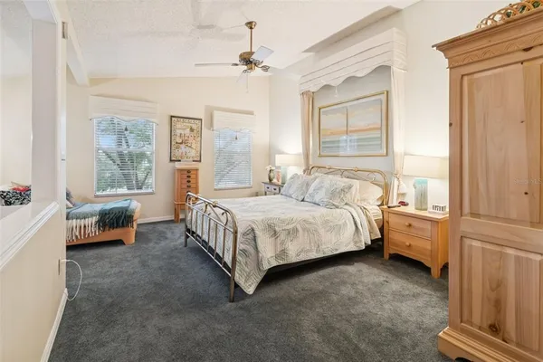 a bedroom with bed and window