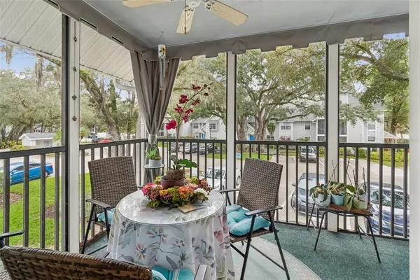 a view of a balcony with furniture