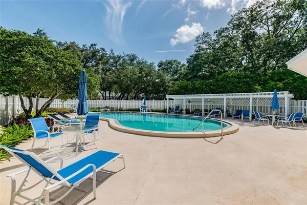 a view of a patio with a table and chairs