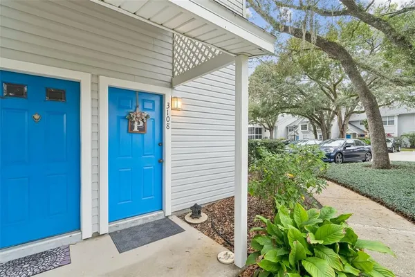 a view of entryway bedroom and hall with wooden floor