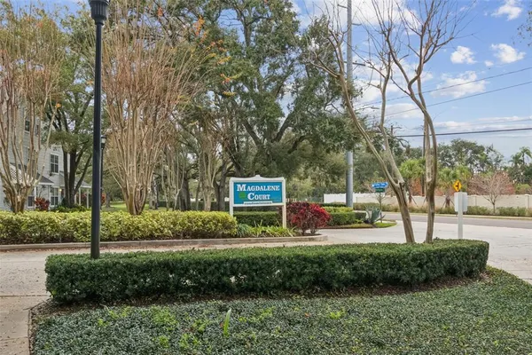 an aerial view of residential houses with city view