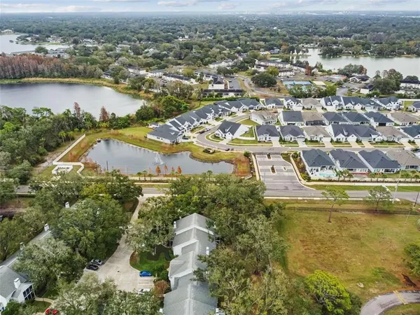 an aerial view of residential houses with outdoor space