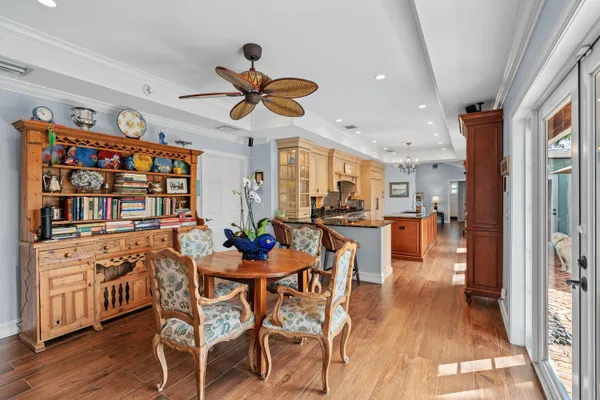 a view of a dining room with furniture window and wooden floor