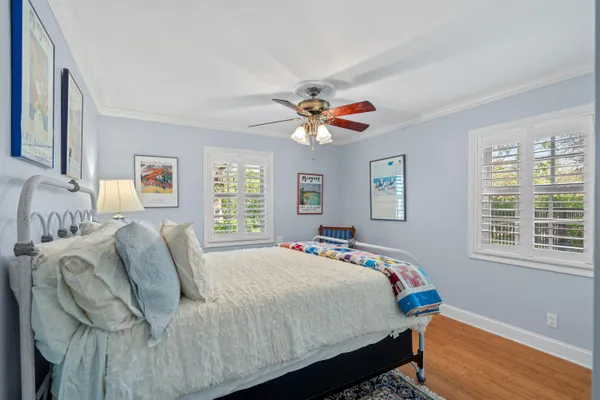 a bedroom with bed and a window