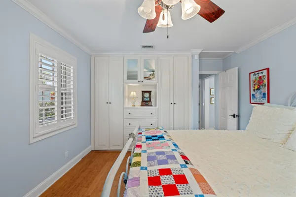 a room that has a bed and a chandelier