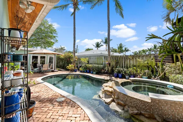 a view of a swimming pool with a patio