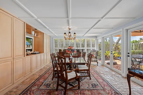 a view of a dining room with furniture window and outside view