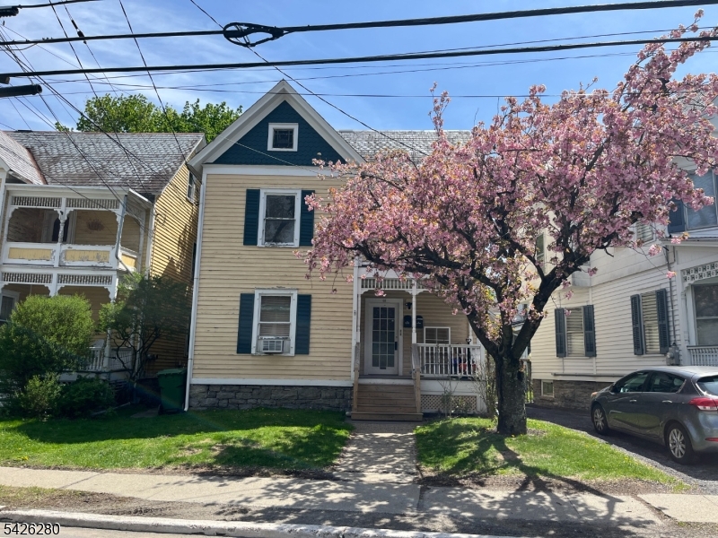 a front view of a house with garden
