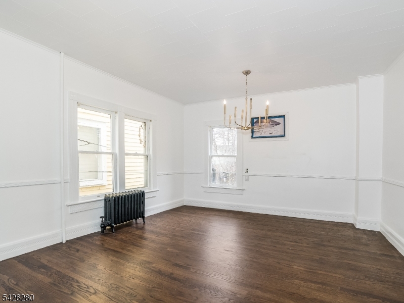 68 High Street Newton, NJ 07860 - Photo 11 of 31 an empty room with wooden floor and windows