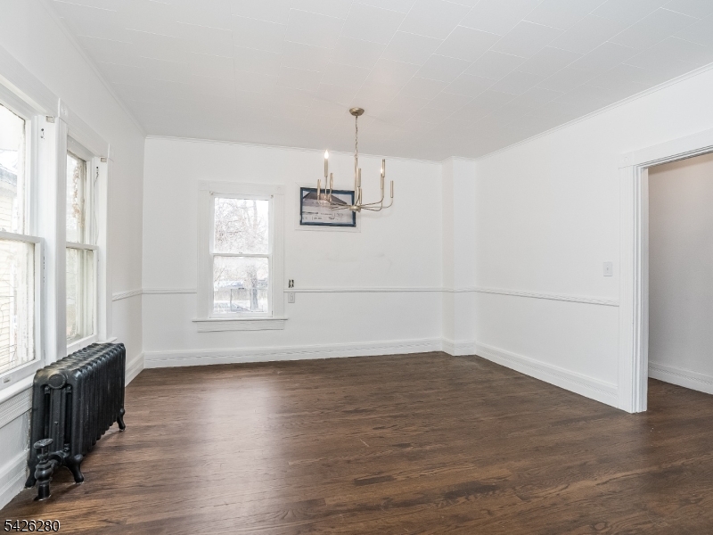 68 High Street Newton, NJ 07860 - Photo 13 of 31 an empty room with wooden floor and windows