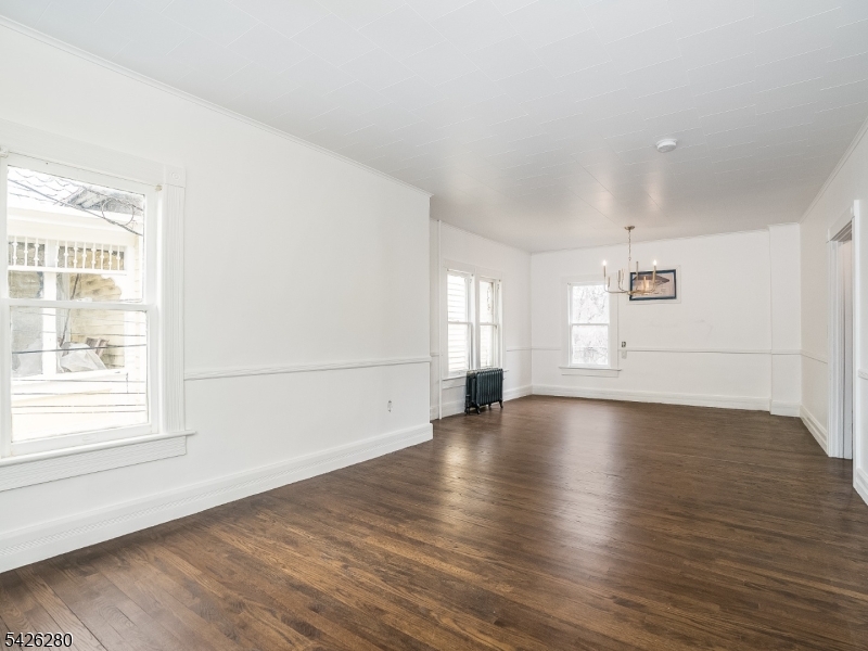 68 High Street Newton, NJ 07860 - Photo 15 of 31 an empty room with wooden floor and windows