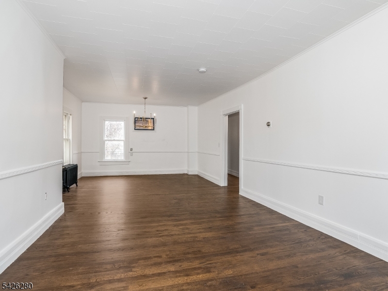68 High Street Newton, NJ 07860 - Photo 16 of 31 an empty room with wooden floor and windows