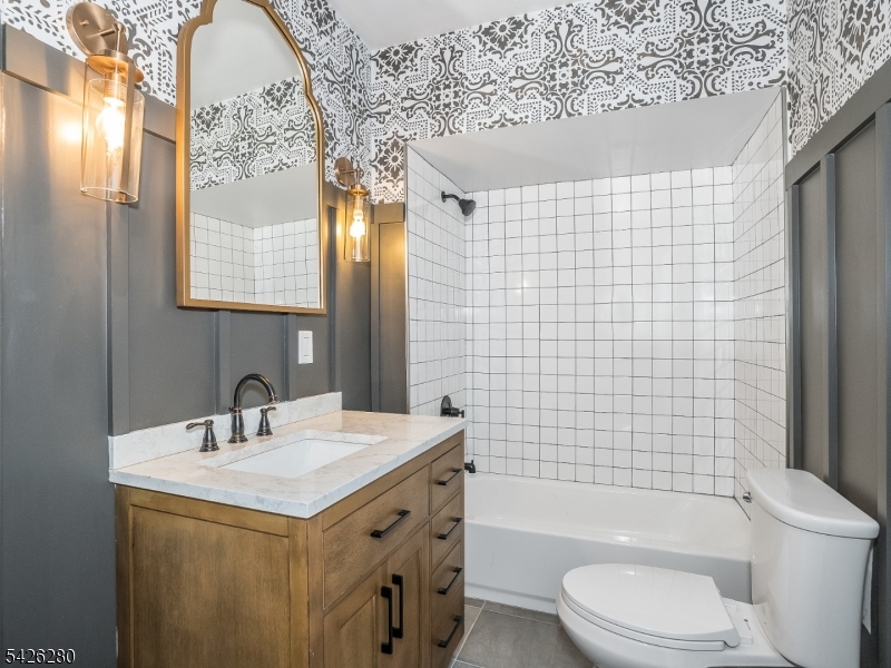 68 High Street Newton, NJ 07860 - Photo 17 of 31 a bathroom with a sink a toilet and shower