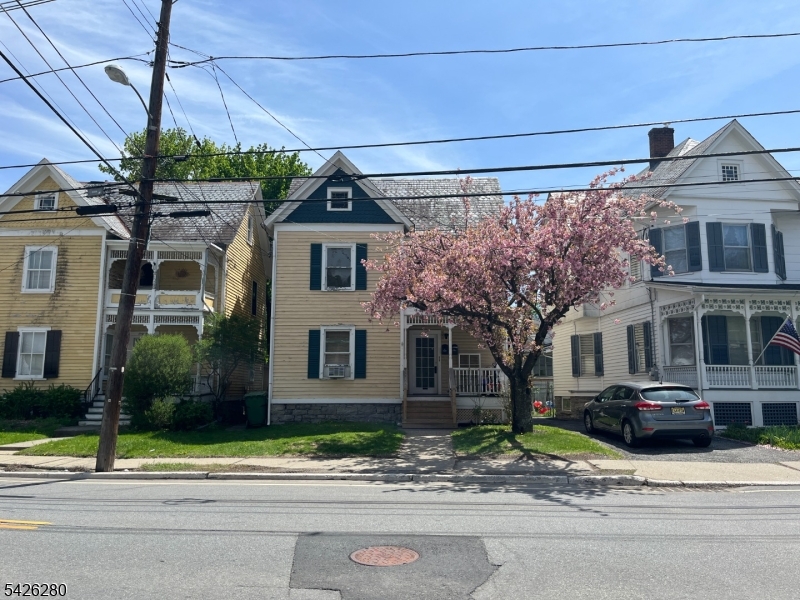 68 High Street Newton, NJ 07860 - Photo 2 of 31 a front view of a house with a garden and plants