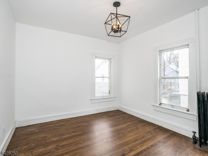 68 High Street Newton, NJ 07860 - Photo 23 of 31 an empty room with wooden floor and windows