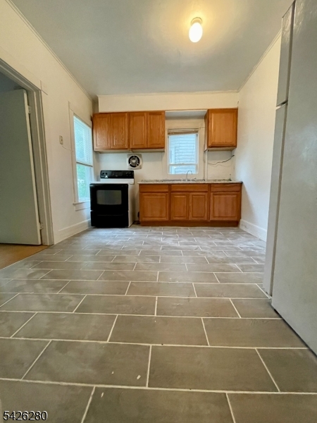 68 High Street Newton, NJ 07860 - Photo 26 of 31 a view of a kitchen with stainless steel appliances a sink and a counter top space
