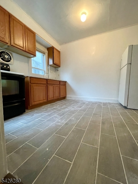68 High Street Newton, NJ 07860 - Photo 27 of 31 a room with gym equipment and stainless steel appliances