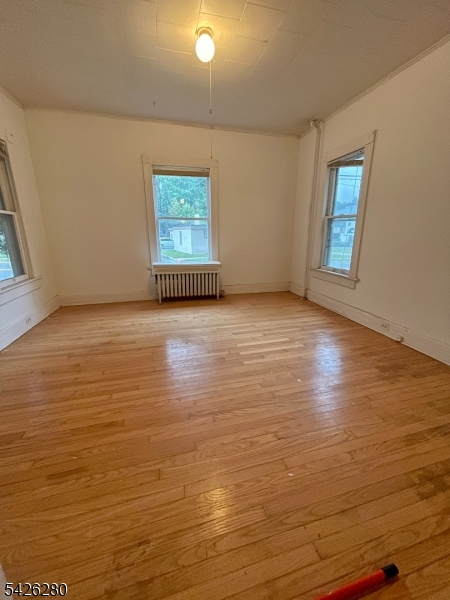 68 High Street Newton, NJ 07860 - Photo 29 of 31 a view of an empty room with window and wooden floor