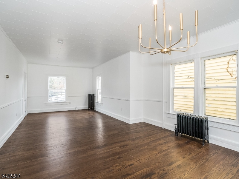 68 High Street Newton, NJ 07860 - Photo 9 of 31 an empty room with wooden floor and windows