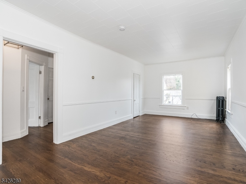 68 High Street Newton, NJ 07860 - Photo 10 of 31 a view of empty room with wooden floor and fan