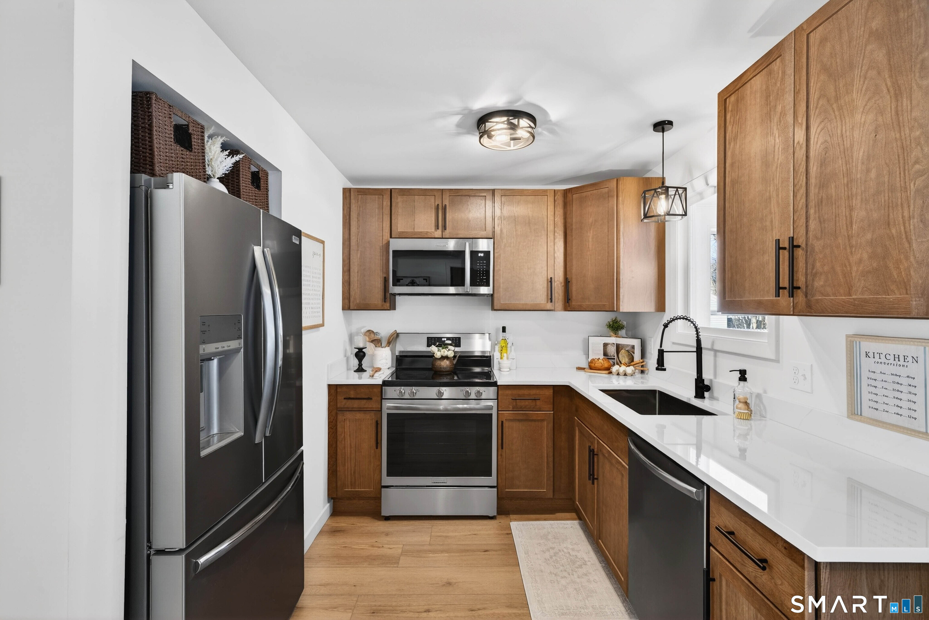 168 Park Avenue Colchester, CT 06415 - Photo 11 of 40 a kitchen with stainless steel appliances granite countertop a refrigerator stove and sink