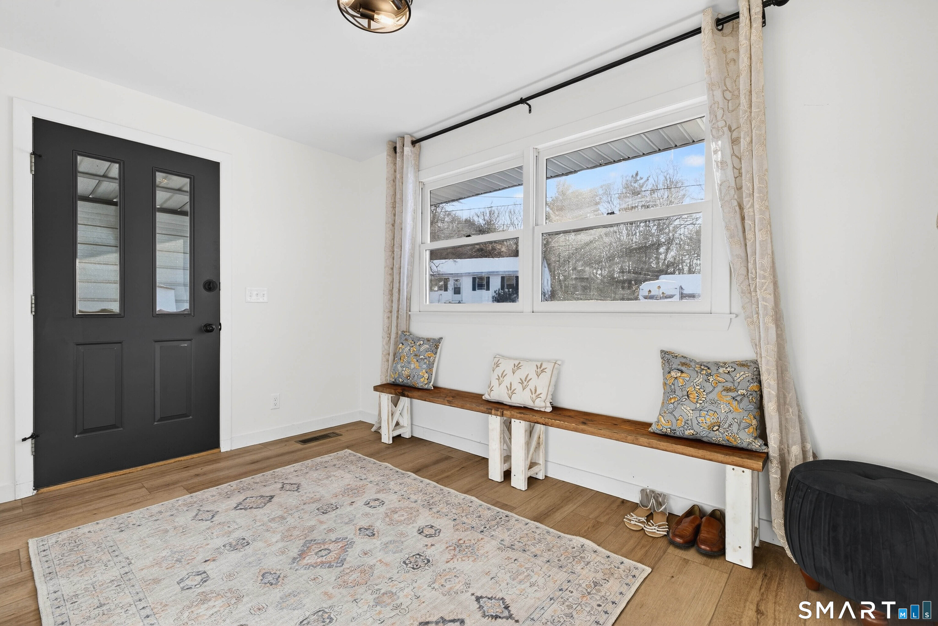 168 Park Avenue Colchester, CT 06415 - Photo 24 of 40 a view of a bedroom with wooden floor and a window