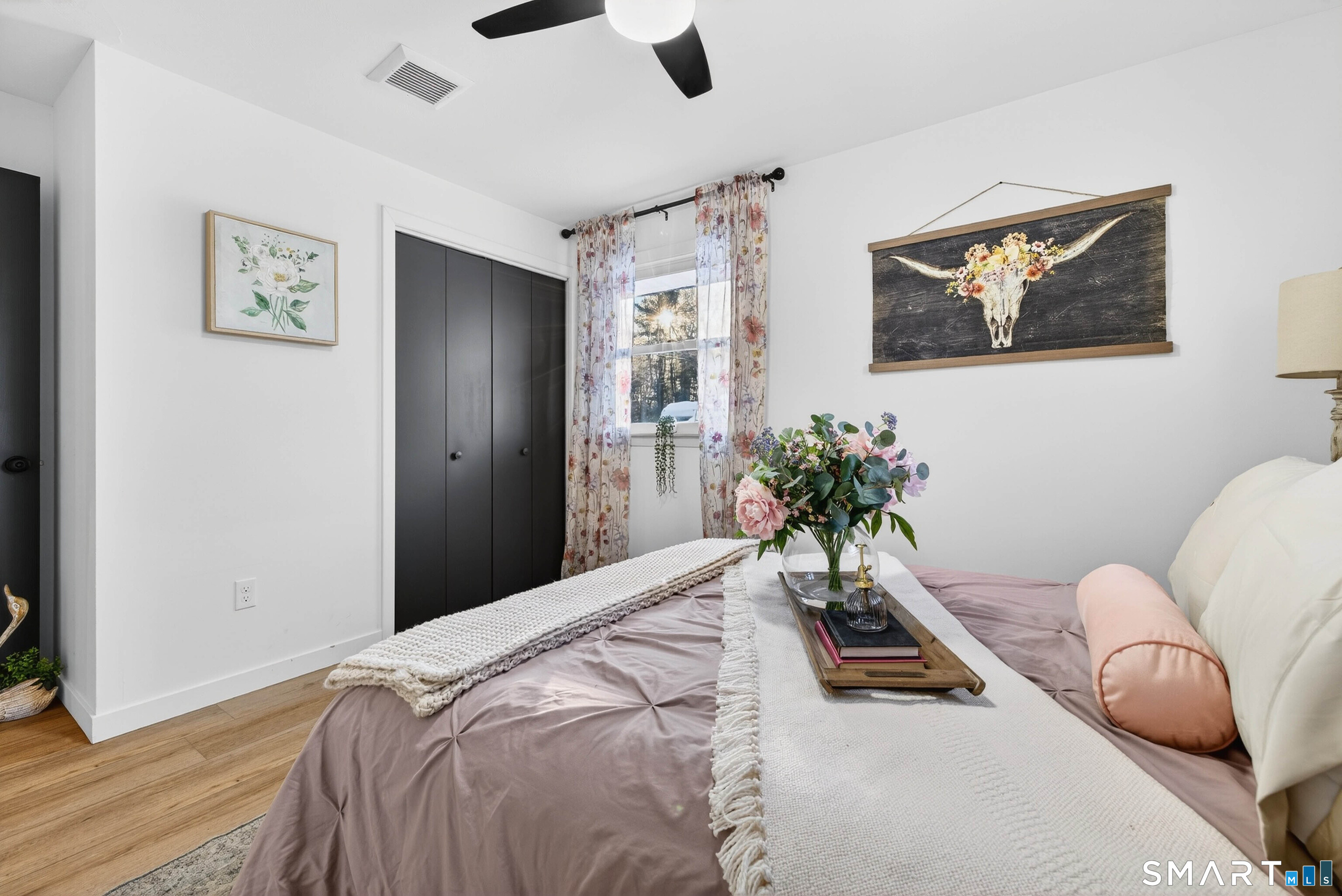 168 Park Avenue Colchester, CT 06415 - Photo 28 of 40 a bedroom with a bed and a painting on the wall