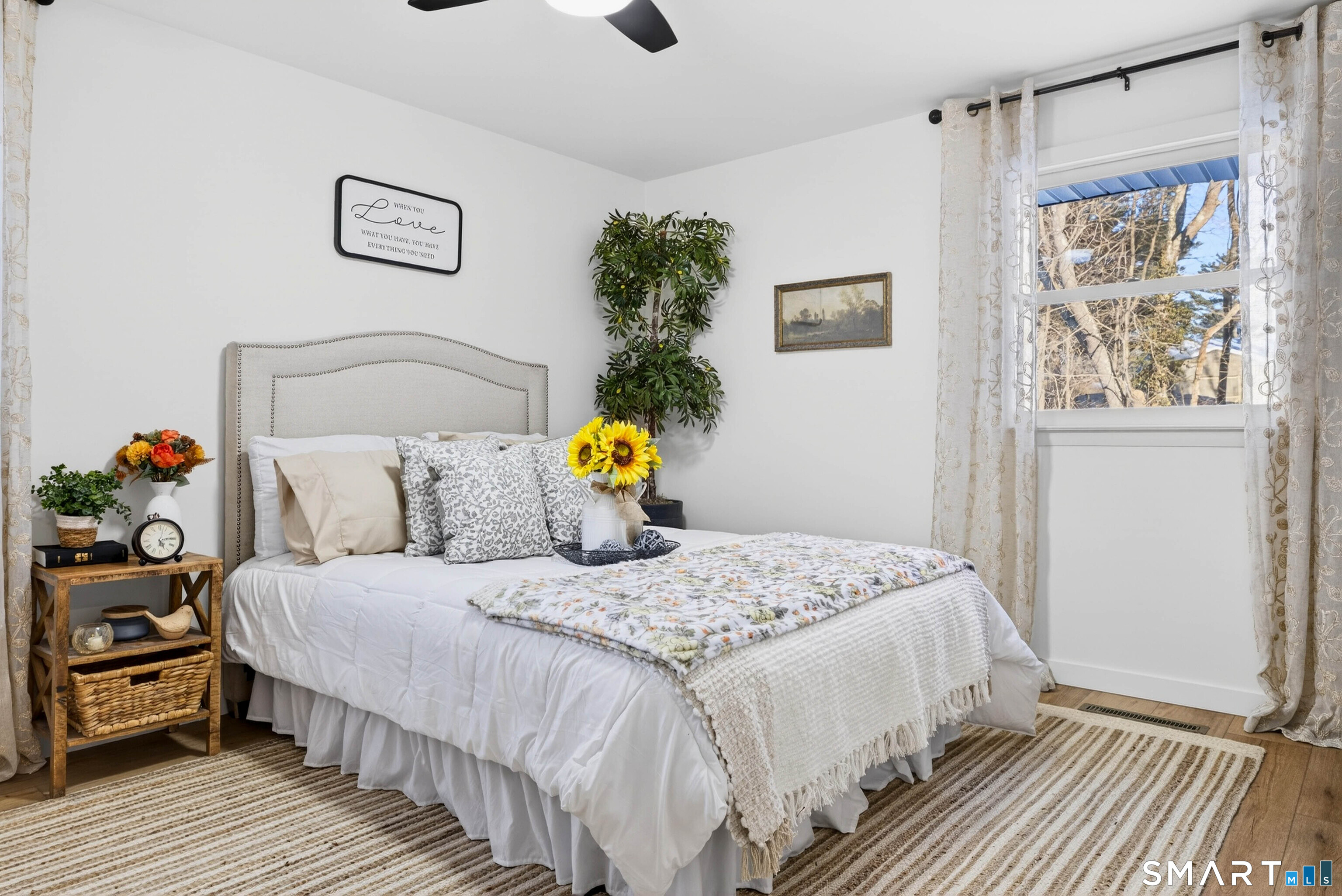 168 Park Avenue Colchester, CT 06415 - Photo 31 of 40 a bedroom with a bed a painting on the wall and a window