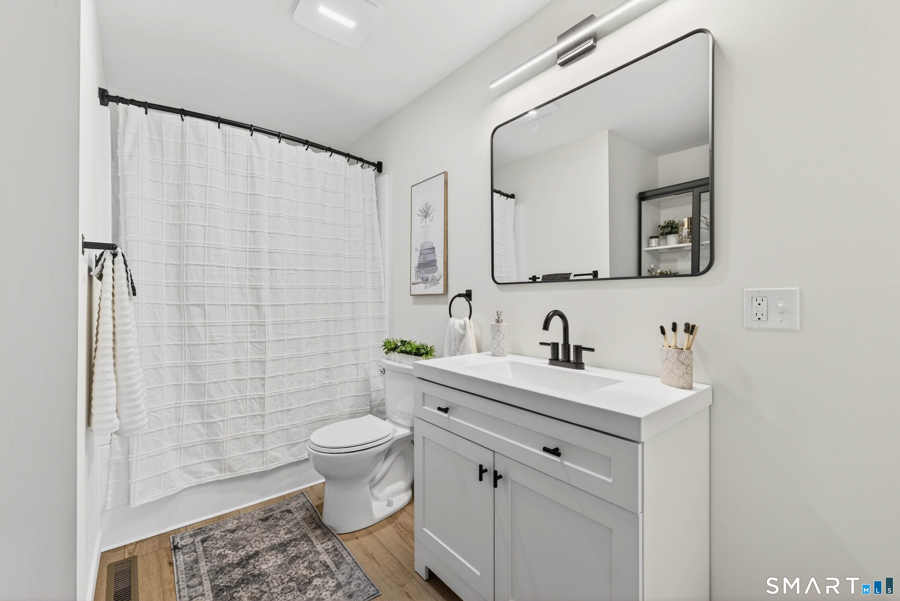 168 Park Avenue Colchester, CT 06415 - Photo 35 of 40 a view of bathroom with a sink and a mirror