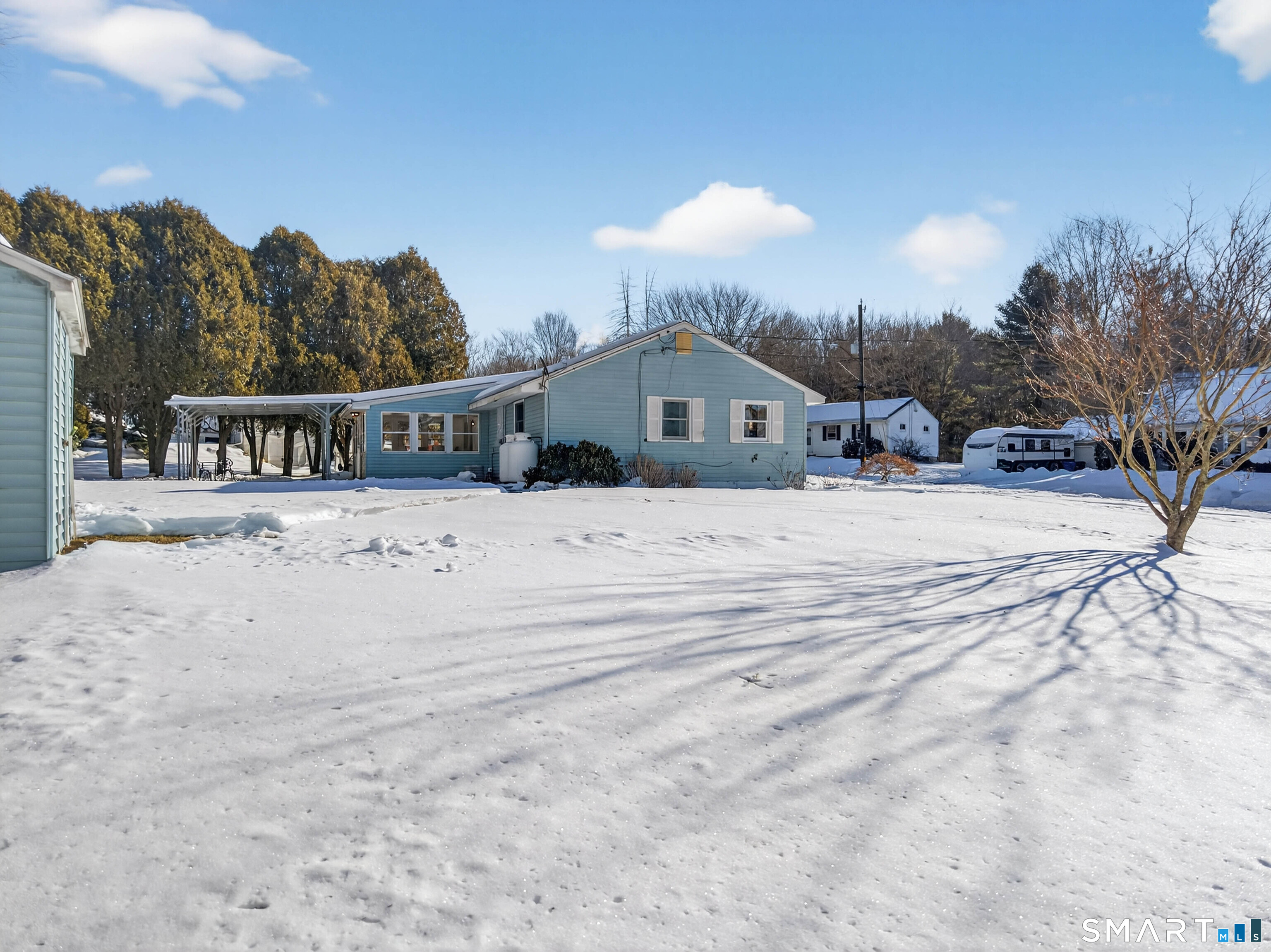 168 Park Avenue Colchester, CT 06415 - Photo 39 of 40 a view of a house with snow on the side of the road