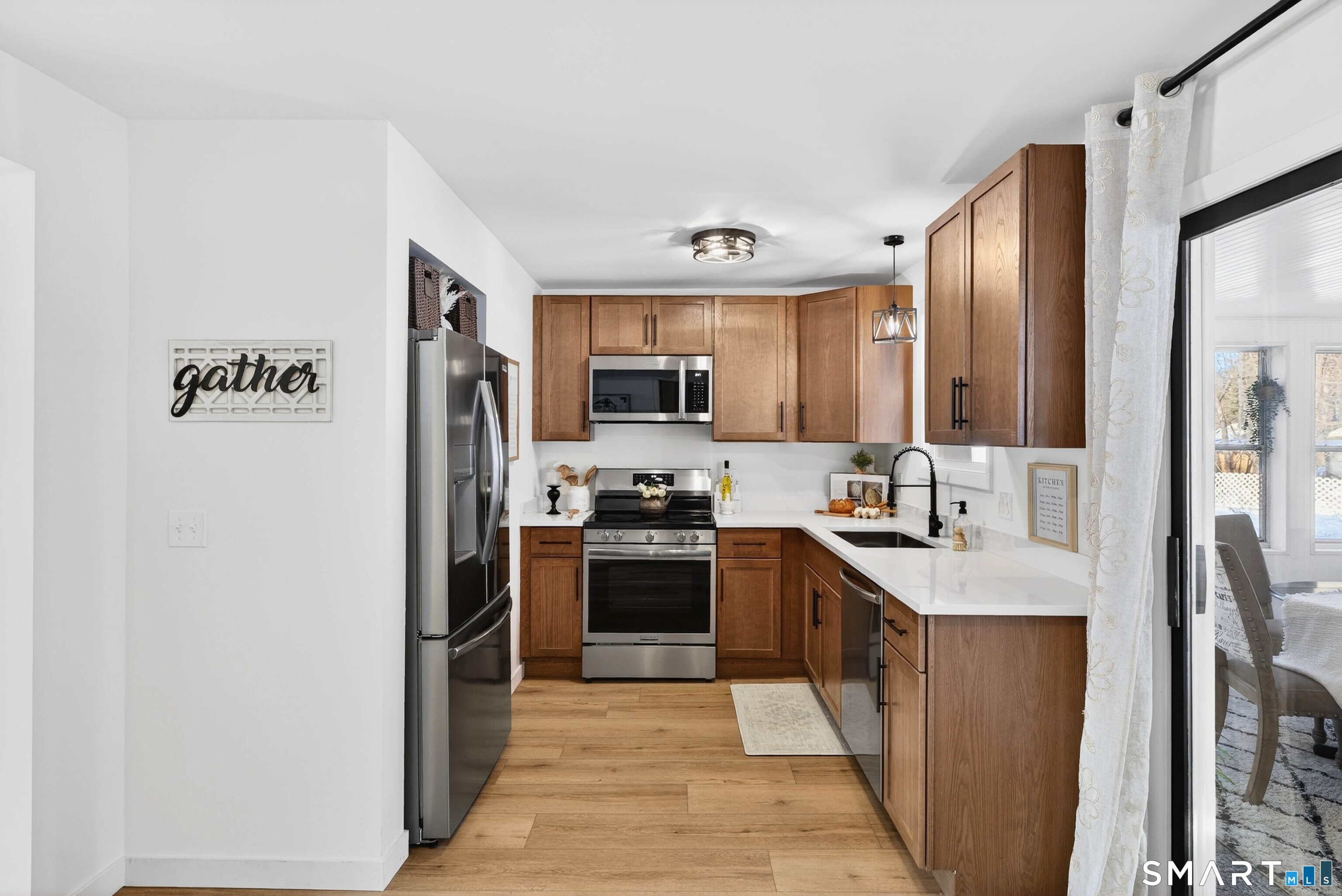 168 Park Avenue Colchester, CT 06415 - Photo 9 of 40 a kitchen with stainless steel appliances granite countertop a refrigerator a stove top oven a sink and dishwasher