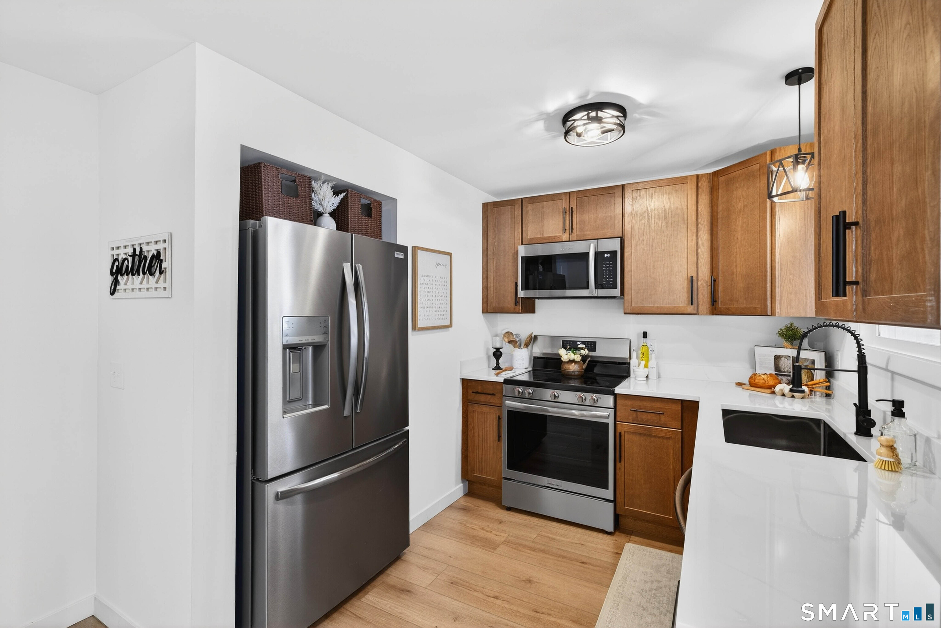 168 Park Avenue Colchester, CT 06415 - Photo 10 of 40 a kitchen with stainless steel appliances granite countertop a refrigerator stove and microwave