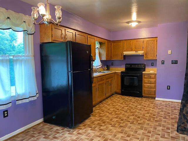 1058 Red Tail Road Goodview, VA 24095 - Photo 20 of 34 a kitchen with stainless steel appliances granite countertop a refrigerator a stove and a sink