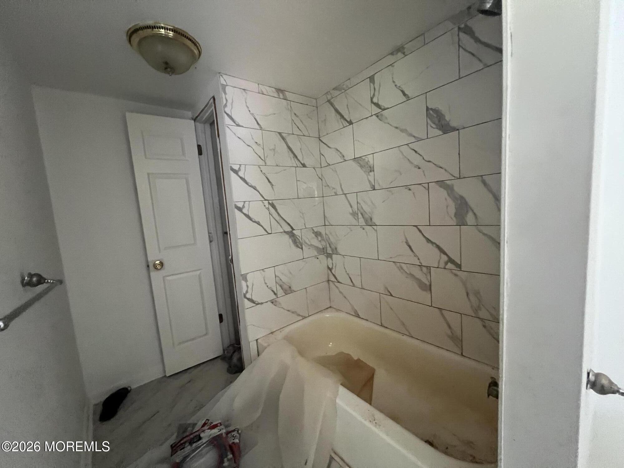 138 Disbrow Hill Road Millstone Township, NJ 08535 - Photo 23 of 41 a bathroom with a bathtub and shower