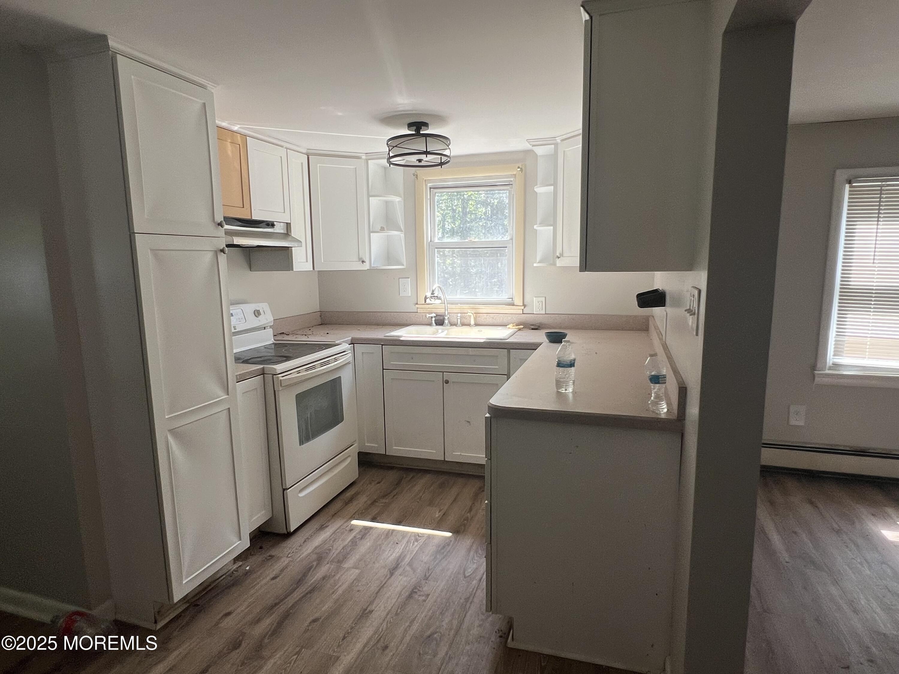 138 Disbrow Hill Road Millstone Township, NJ 08535 - Photo 25 of 33 a kitchen with a sink stove and refrigerator