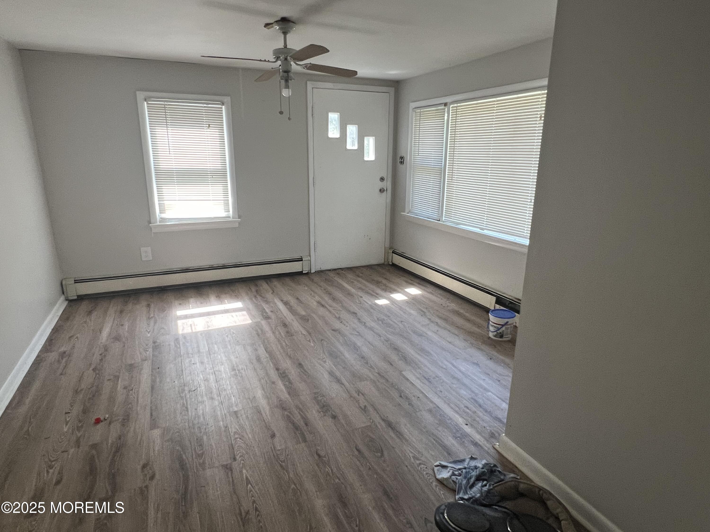 138 Disbrow Hill Road Millstone Township, NJ 08535 - Photo 26 of 33 wooden floor in an empty room with a window