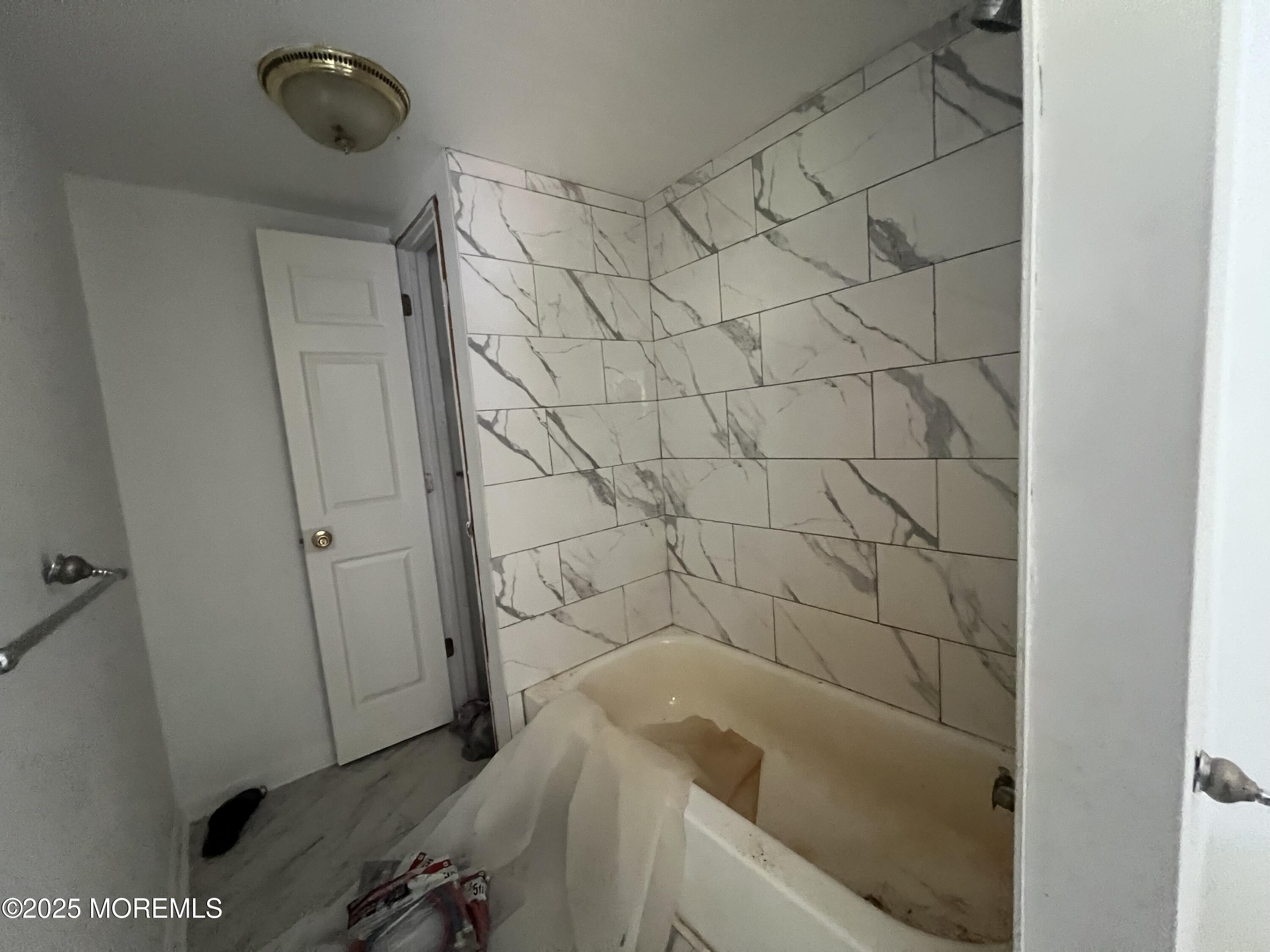 138 Disbrow Hill Road Millstone Township, NJ 08535 - Photo 33 of 33 a bathroom with a bathtub and shower