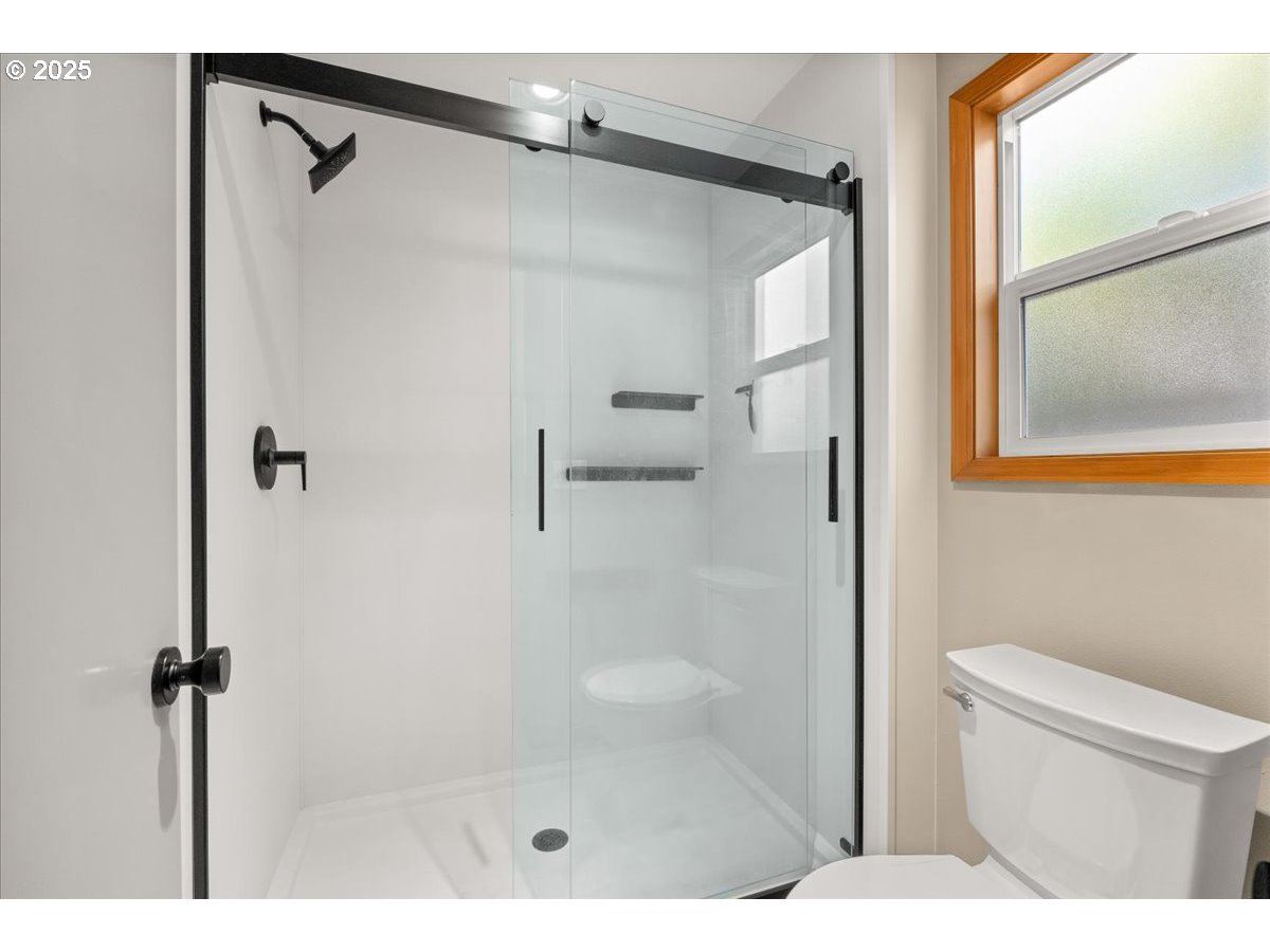 2108 B Street Forest Grove, OR 97116 - Photo 20 of 36 a bathroom with a shower and a toilet