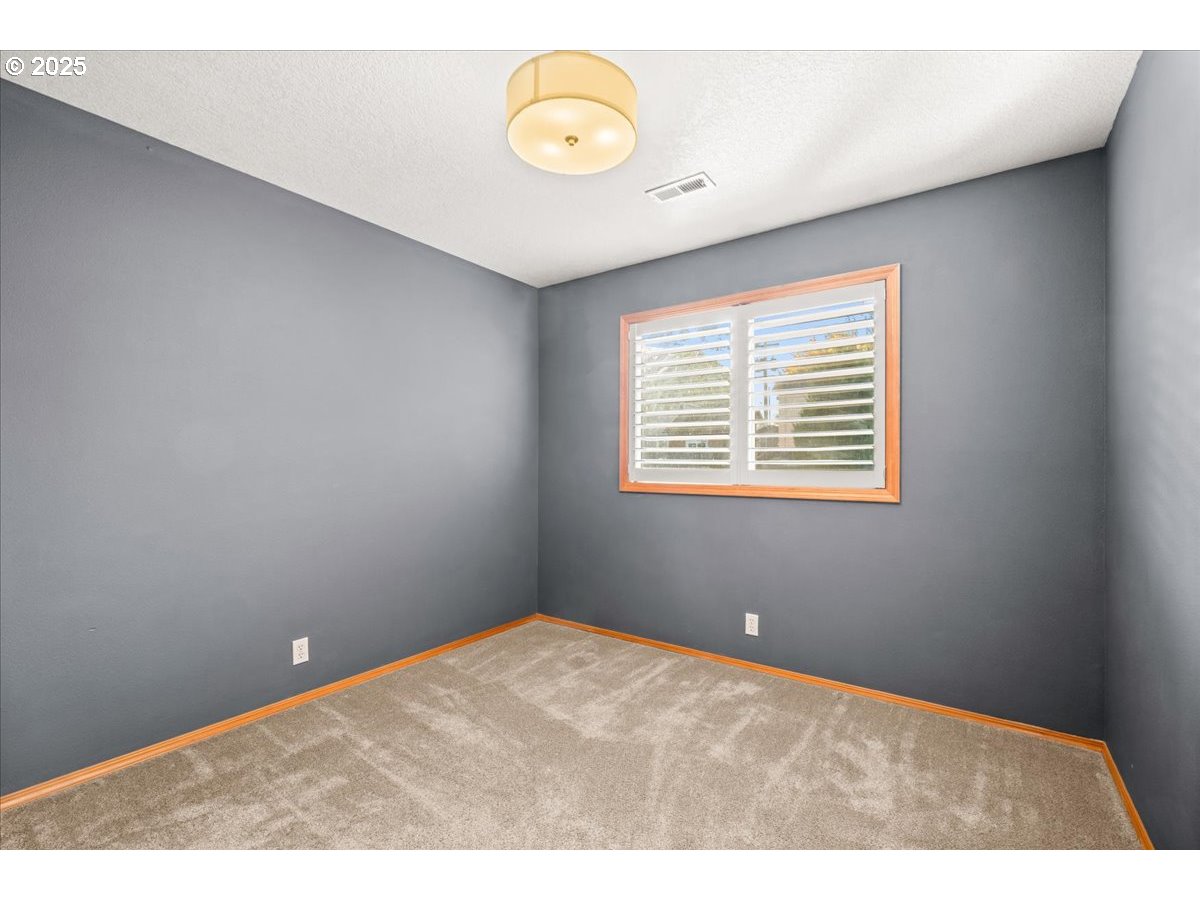 2108 B Street Forest Grove, OR 97116 - Photo 24 of 36 a view of an empty room with a window