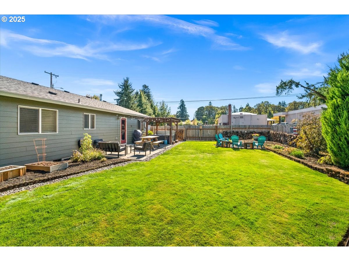 2108 B Street Forest Grove, OR 97116 - Photo 35 of 36 a view of a patio with table and chairs under an umbrella