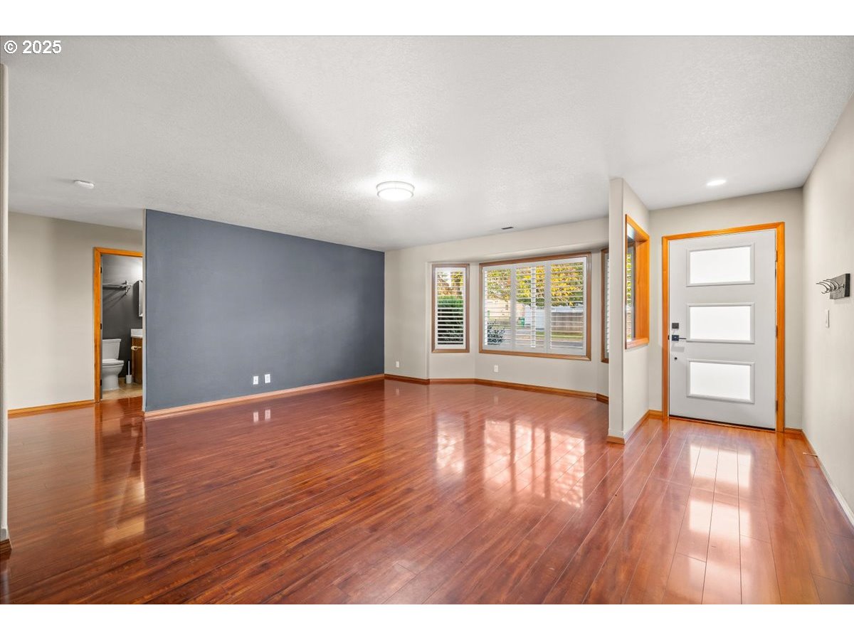 2108 B Street Forest Grove, OR 97116 - Photo 8 of 36 a view of an empty room with window and wooden floor