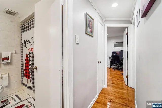 a hallway with kids room in bathroom