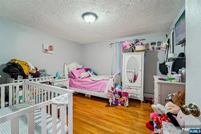 a bedroom with furniture and toys
