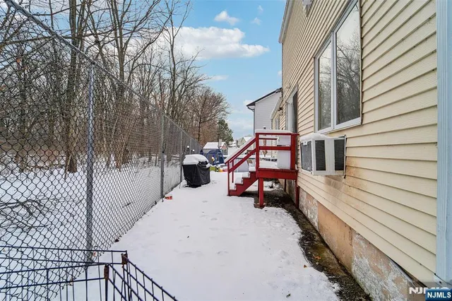 a view of a patio with a table and chairs