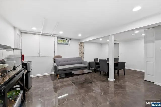 a lobby with furniture and a rug