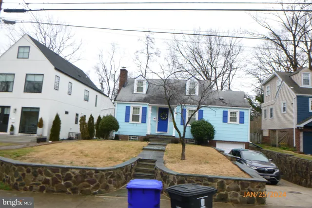 a view of a house with roof and tree