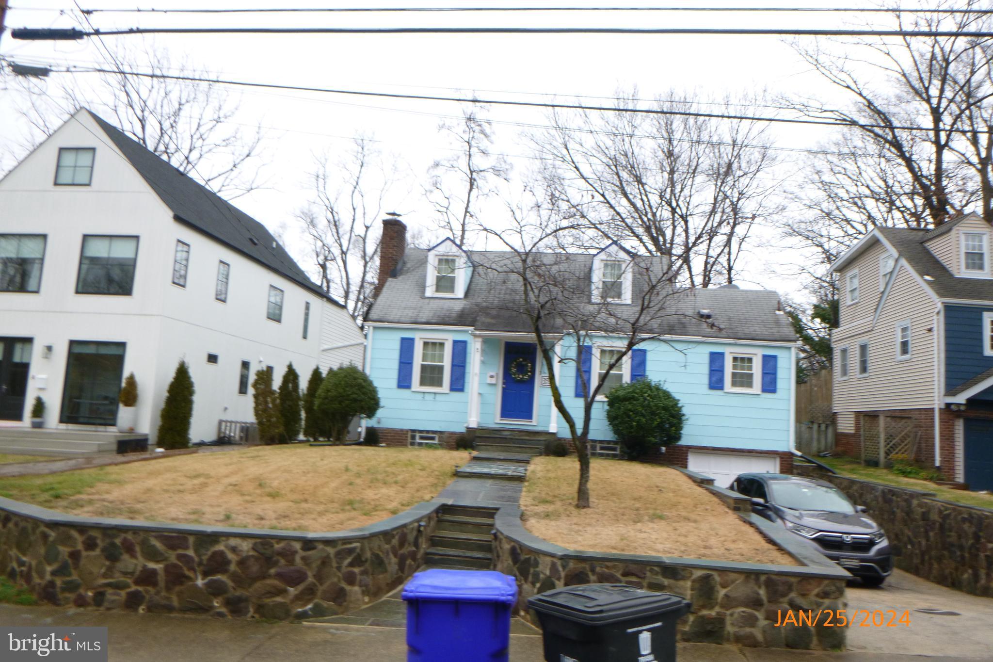 a view of a house with roof and tree