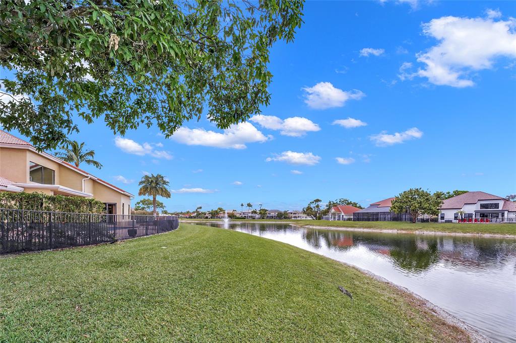 22280 Tupelo Place Boca Raton, FL 33428 - Photo 12 of 53 a view of a lake with houses