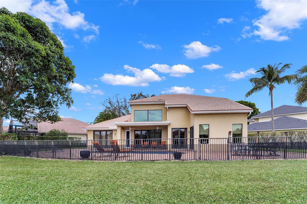 22280 Tupelo Place Boca Raton, FL 33428 - Photo 13 of 53 a view of a house with a front yard